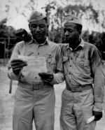 African-American US Marines Staff Sergeant Timerlate Kirven and Corporal Samuel J. Love, Sr. received Purple Heart medals during the battle for Saipan, Mariana Islands, date unknown