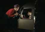 A man and a woman working on an aircraft at the Douglas Aircraft plant, Long Beach, California, United States, Oct 1942