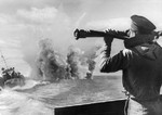 Soviet sailor measuring the range of depth charges, 1 Aug 1943