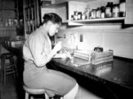 African-American US Army WAC Pfc Johnnie Mae Welton conducting a lab experiment in the serology lab at Fort Jackson Station Hospital, Fort Jackson, South Carolina, United States, 20 Mar 1944