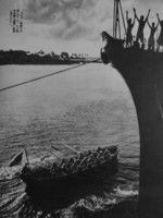 Japanese sailors aboard a warship cheering their comrades in a rowboat, 1941-1943