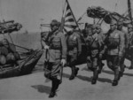 Japanese officer and men at a port, 1942-1943