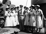 WAVES officers posing on the navigation bridge of  USS General Omar Bundy with Captain Lawrence Wainwright while en route to Pearl Harbor, US Territory of Hawaii, 25 Jun 1945