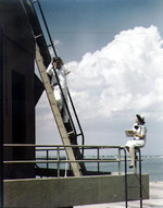 A US Navy Sailor and a WAVES personnel on duty as control tower spotters at Naval Air Station, Norfolk, Virginia, United States, circa 1944-1945