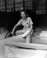 WAVES Aviation Metalsmith 2nd Class Kathryn A. Wolny repairing an inflatable liferaft for use on patrol planes, Naval Air Station Kaneohe, US Territory of Hawaii, 9 Jul 1945