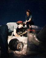WAVES Seamen 1st Class Martha Harrison and Lorrain Taylor working on the #1 Pratt & Whitney R-2000 engine of a R5D Skymaster aircraft, Naval Air Station, Oakland, California, United States, mid-1945