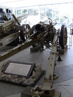 Type 96 15-cm howitzer on display at Yushukan Museum, Tokyo, Japan, 7 Sep 2009, photo 2 of 2; note Type 89 15-cm cannon, A6M Zero Model 52 fighter in background
