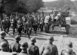 Artur Axmann, General Kunze, and Major General Philipp (school commandant) touring an artillery school at Jüterbog, Germany, 23 Jul 1943