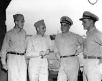 Lieutenant May, Rear Admiral Arthur Struble, Rear Admiral Daniel Barbey, and Lieutenant Commander William Mailliard at Hollandia, New Guinea, Nov 1944