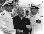 Burke shaking hands of Admiral George W. Anderson, Jr. and Admiral David L. McDonald as the latter relieved the former as Chief of Naval Operations, Washington Navy Yard, DC, United States, 1 Aug 1963