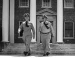 Admiral Arleigh Burke and Vice Admiral Austin Doyle in front of the Headquarters of the Chief of Naval Air Training, Naval Air Station Glenview, Illinois, United States, 16 Sep 1955