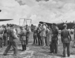 Claire Chennault with Chinese officers at an airfield, Kunming, Yunnan Province, China, 1942-1943; note P-38 fighter