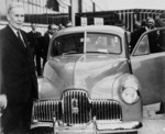 Prime Minister Ben Chifley at the launching of the first mass-produced Australian car at the General Motors-Holden factory, Fisherman