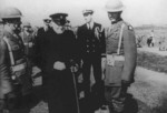 Winston Churchill visiting US Marines on Iceland, 16 Aug 1941; note Ensign Franklin Roosevelt, Jr. and Lieutenant Colonel Oliver Smith also present