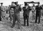 Major General Edward Brooks (behind Eisenhower) demonstrating M1 Carbines to Dwight Eisenhower, Winston Churchill, and Omar Bradley, England, United Kingdom, 15 May 1944, photo 2 of 2