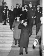 Prime Minister Chamberlain, Prime Minister Daladier, and Ambassador Francois-Poncet departing from Munich Conference after the agreement was reached, Germany, 29 Sep 1938
