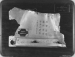 Plaque containing a fragment of a wrecked B-25 bomber that had participated in the Doolittle Raid; this was presented to James Doolittle on 19 Apr 1947