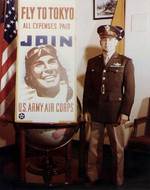 Brigadier General Doolittle posing next to a propaganda poster, circa 1943