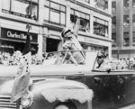 General Dwight Eisenhower waving to the crowd at a parade, United States, 1945