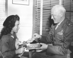 Graves Erskine with girl scout Shirley Barton, 1945
