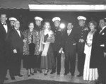 Actor John Wayne, Major General Graves Erskine, and others at the premier of the film Sands of Iwo Jima, 14 Dec 1949