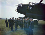 King George VI inspecting ground crewmen during his visit to No. 617 Squadron (Dambusters) and No. 57 Squadron at RAF Scampton, Lincolnshire, England, United Kingdom, 27 May 1943; note Lancaster B Mk I bomber 