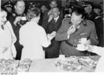 Göring trying a dish made by a German housewife during an event celebrating homemakers, Berlin, Germany, 29 Jan 1937