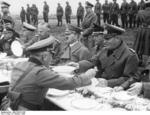 Hitler having a meal with German Army officers on the side of the road between Franzensbad and Eger, Sudetenland, Germany, 3 Oct 1938