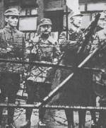 Heinrich Himmler (holding flag) outside the office of the Military District for Bayern (Bavaria) during the Beer Hall Putsch, München (Munich), Germany, 9 Nov 1923