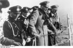 Erich Raeder, Werner von Blomberg, and Adolf Hitler aboard German cruiser Deutschland in the North Sea, Apr 1934
