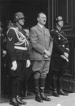 Josef Dietrich, Adolf Hitler, and Heinrich Himmler at the entrance of the Chancellery in Berlin, Germany, 20 Apr 1937 during a celebration for Hitler