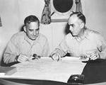 Barbey and Kinkaid over a map of New Guinea, 5 Jan 1944