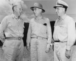 Vice Admiral Theodore Wilkinson (left), Vice Admiral Thomas Kinkaid (center), and Rear Admiral Daniel Barbey (right) attend a meeting of senior officers of US Navy Third and Seventh Fleets at Seventh Fleet Headquarters to plan the invasion of Leyte, Philippines, circa Sep 1944