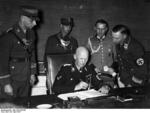 German State Secretary Hans Lammers at his desk with his adjutants, Berlin, Germany, 29 Apr 1937