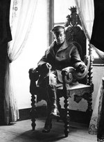 US Army Brigadier General Douglas MacArthur sitting in a chair in St. Benoit Chateau, France, 19 Sep 1918