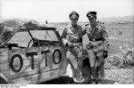 Hans-Joachim Marseille and another pilot posing next to a Kübelwagen vehicle, Libya, summer 1942