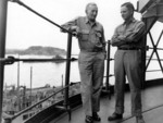 US Navy Vice Admiral John S. McCain, Sr. with his son Commander John S. McCain, Jr. together for the last time in Tokyo Bay, Japan on the day of the Surrender Ceremony, 2 Sep 1945