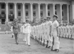 Louis Mountbatten inspecting British Royal Navy Guard of Honour outside the Minicipal Building, Singapore prior to the surrender ceremony, 12 Sep 1945