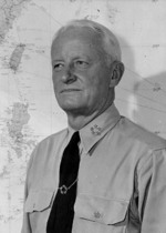 Portrait of US Navy Fleet Admiral Chester Nimitz at his office in Guam, Mariana Islands, circa 16-19 Dec 1944; note five-star tie clasp, which was a gift to him
