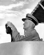 Fleet Admiral Chester Nimitz watching an anti-submarine weapons demonstration aboard destroyer USS Wiltsie in the Atlantic Ocean, 11 May 1946