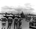 US Navy Adms R. English & C. Nimitz at Pearl Harbor, Hawaii, United States as USS Trout returned with 2 POWs from the sunken Japanese cruiser Mikuma, 14 Jun 1942