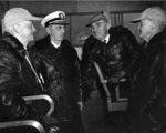 Fleet Admiral Nimitz, Fleet Admiral Leahy, President Truman, and Vice Admiral Mitscher aboard USS Franklin D. Roosevelt during maneuvers off the Virginia Capes, United States, 24 Apr 1946