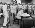 Nimitz signing the instrument of surrender, Tokyo Bay, Japan, 2 Sep 1945, photo 2 of 2