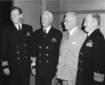 Commander Eugene Fluckney, Fleet Admiral Chester Nimitz, a civilian, and Vice Admiral William Calhoun, Coronado, California, United States, 21 Jan 1953
