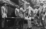 Admiral Chester Nimitz awarding Lieutenant Colonel Evans Carlson a gold star to his Navy Cross medal, Guadalcanal, Solomon Islands, 30 Sep 1942