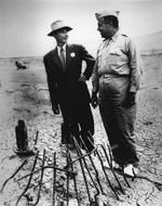 J. Robert Oppenheimer and Leslie Groves at the Trinity test site during a press visit, New Mexico, United States, 1 Sep 1945, photo 1 of 2
