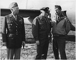 Generals George Patton, Henry “Hap” Arnold, and Mark Clark at the Castelvetrano Airfield, Sicily, Italy, awaiting the arrival of President Roosevelt, 8 Dec 1943.