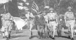 British Army Lieutenant General Arthur Percival and his party carrying the United Kingdom flag on their way to surrender Singapore to the Japanese, 15 Feb 1942, photo 2 of 2