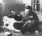 Puyi repairing his own clothing, Fushun War Criminals Management Center re-education camp in Shenyang, China, 1950s