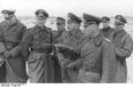 German Army Captain Lang, Field Marshal Erwin Rommel, Lieutenant General Felix Schwalbe, and General Walter Fischer von Weikersthal at the Somme estuary, France, 11 Mar 1944